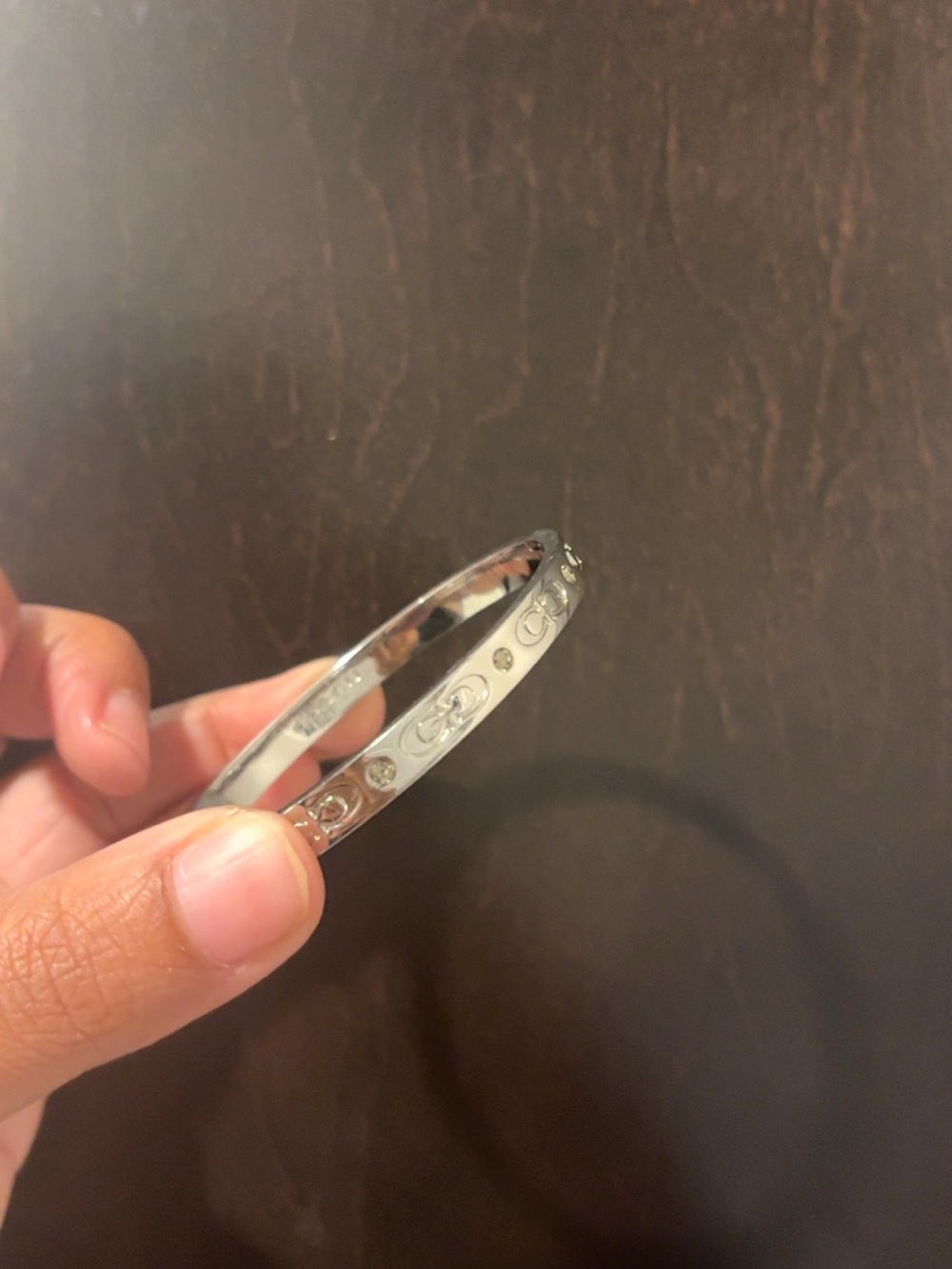 Coach Silver-Tone Engraved Bangle Bracelet - Picture 2 of 2